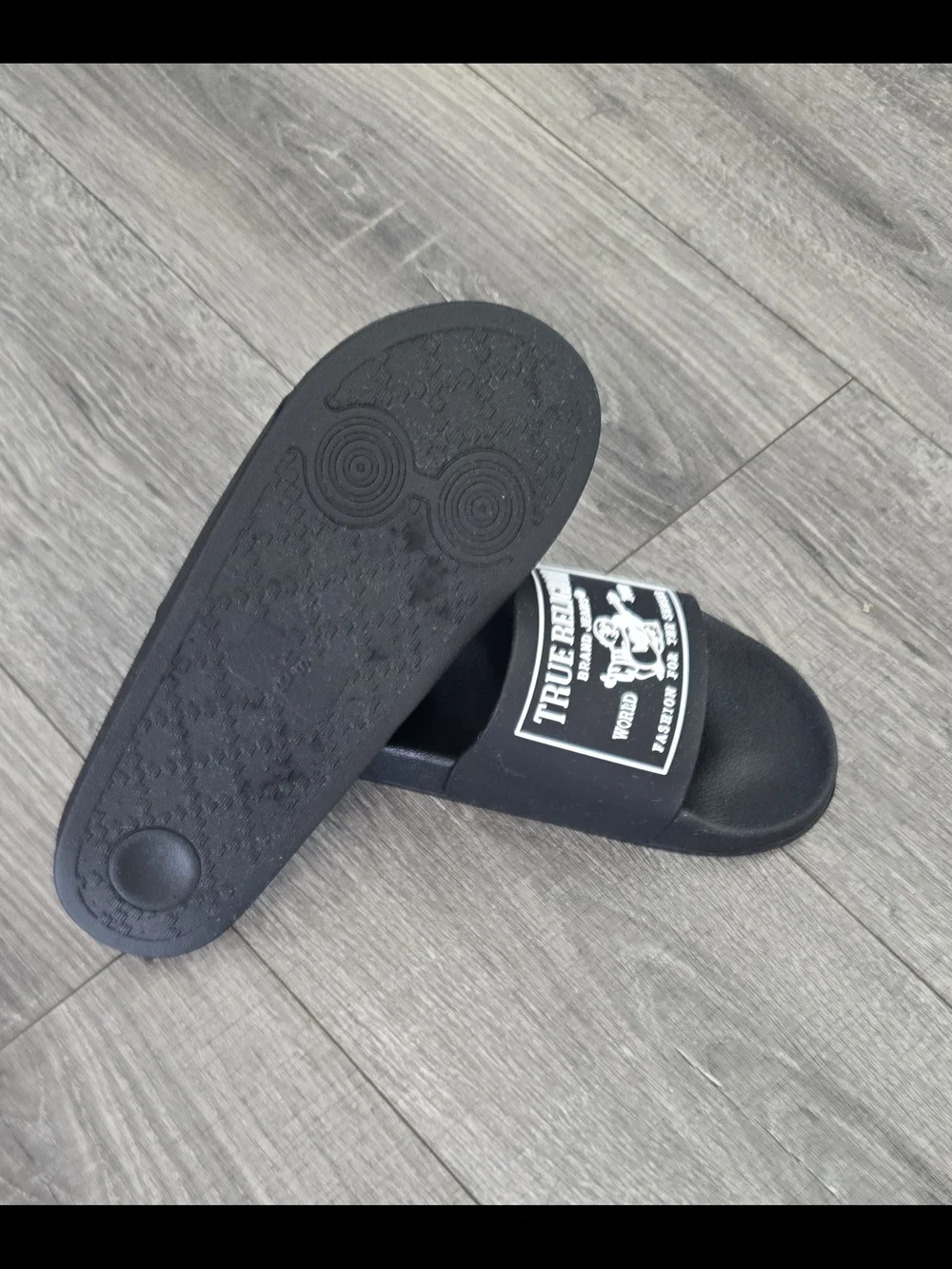 NWOT True Religion black slide sandals in men’s US size 9.